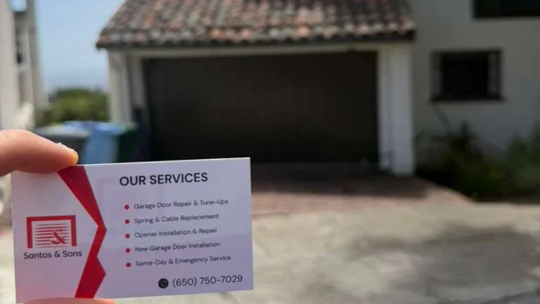 Santos & Sons business card at a Berkeley garage door spring replacement job